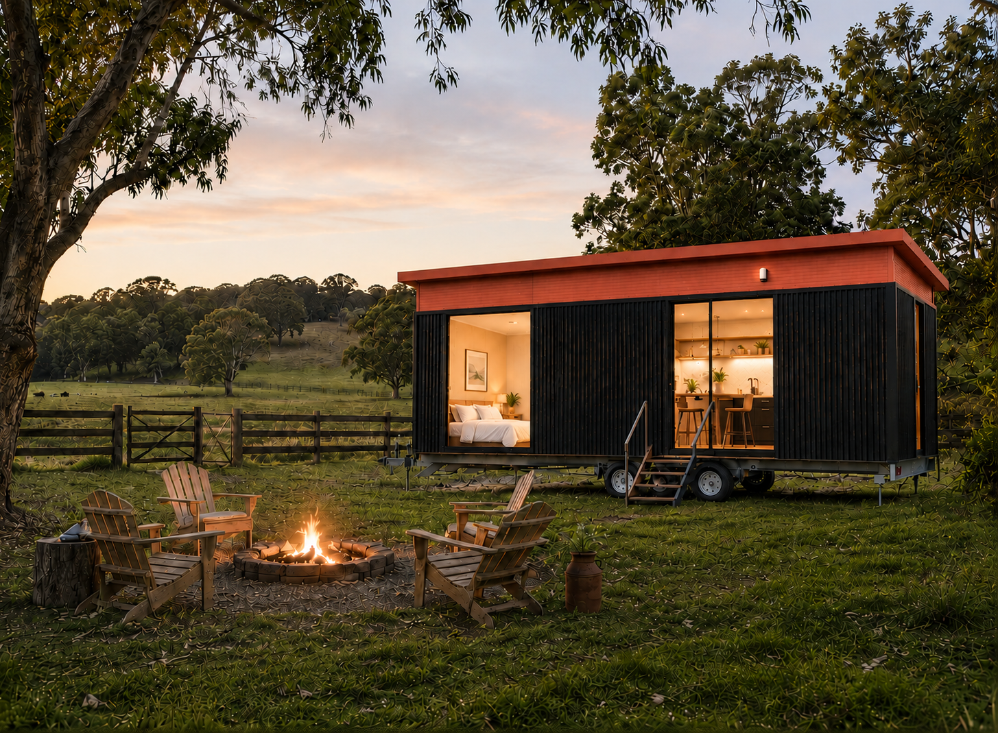 Tiny home on a rural paddock at sunset with a fire pit and chairs